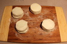 Stack and roll biscuit dough into larger circles