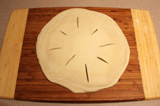 Cut holes in dough to vent steam