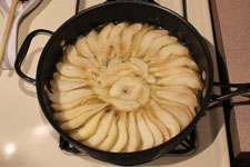 Simmer pears until syrup starts to thicken